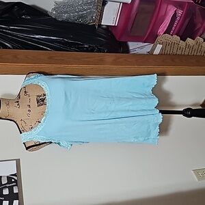 2x blue tank top with lace straps.